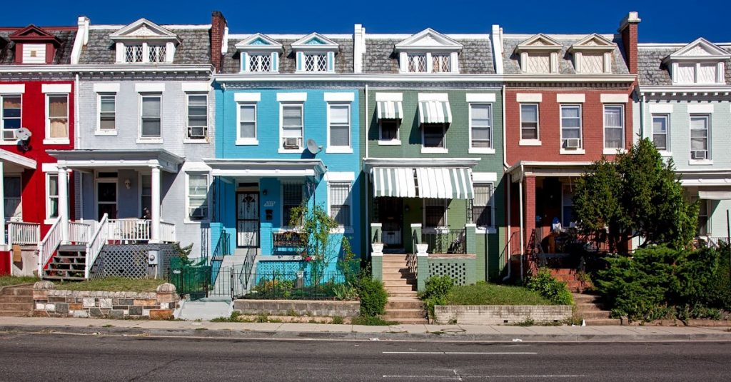 Vibrant row houses on a sunny street capturing urban architecture and charm.